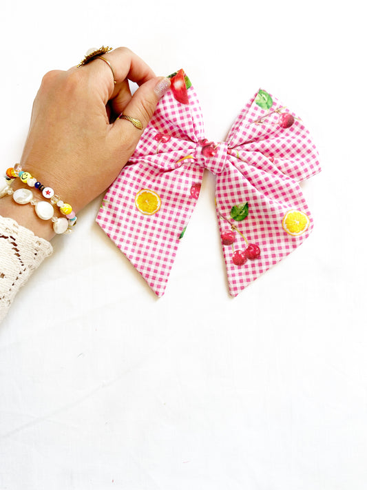 Beau hair bow in pink gingham with a fruit print