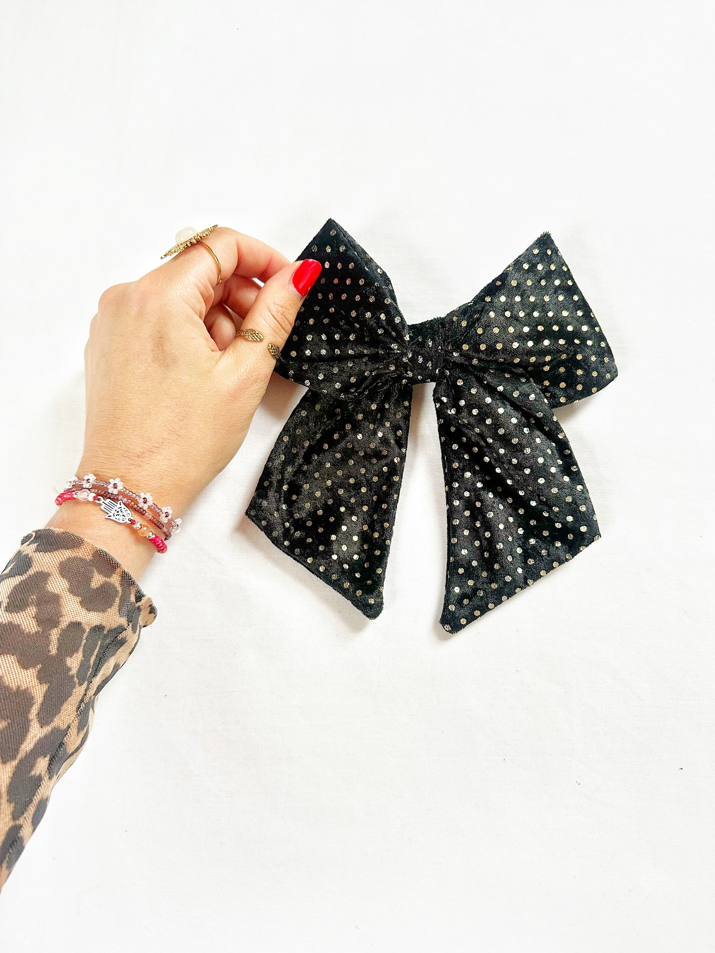 Beau hair bow in black and gold velvet