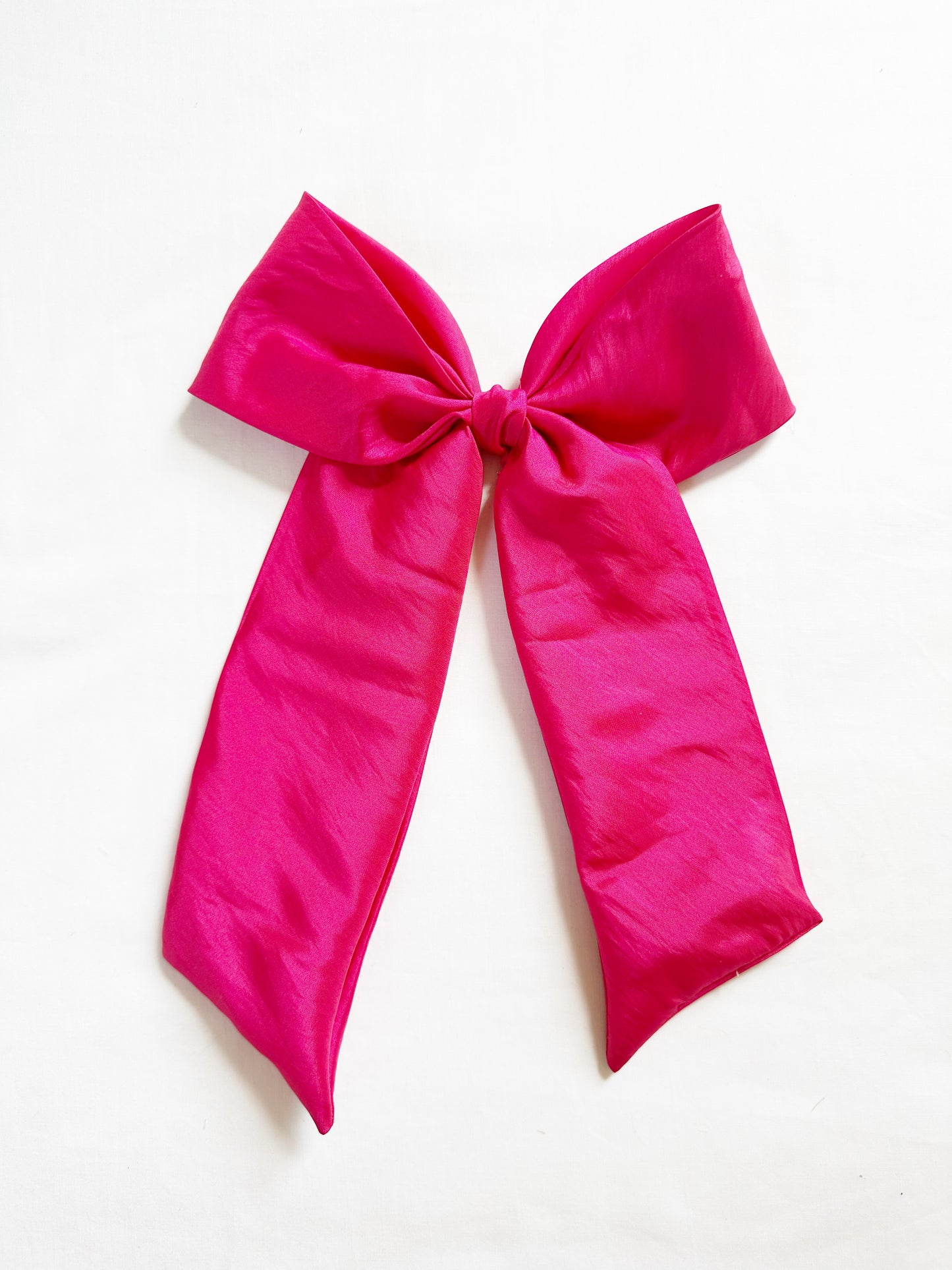 The Power Hair Bow in hot pink silk