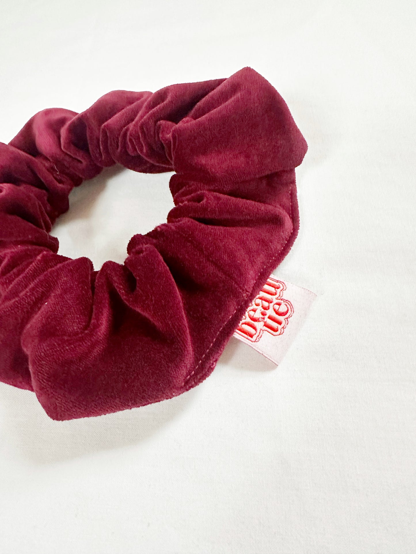 OG scrunchie in burgundy velvet