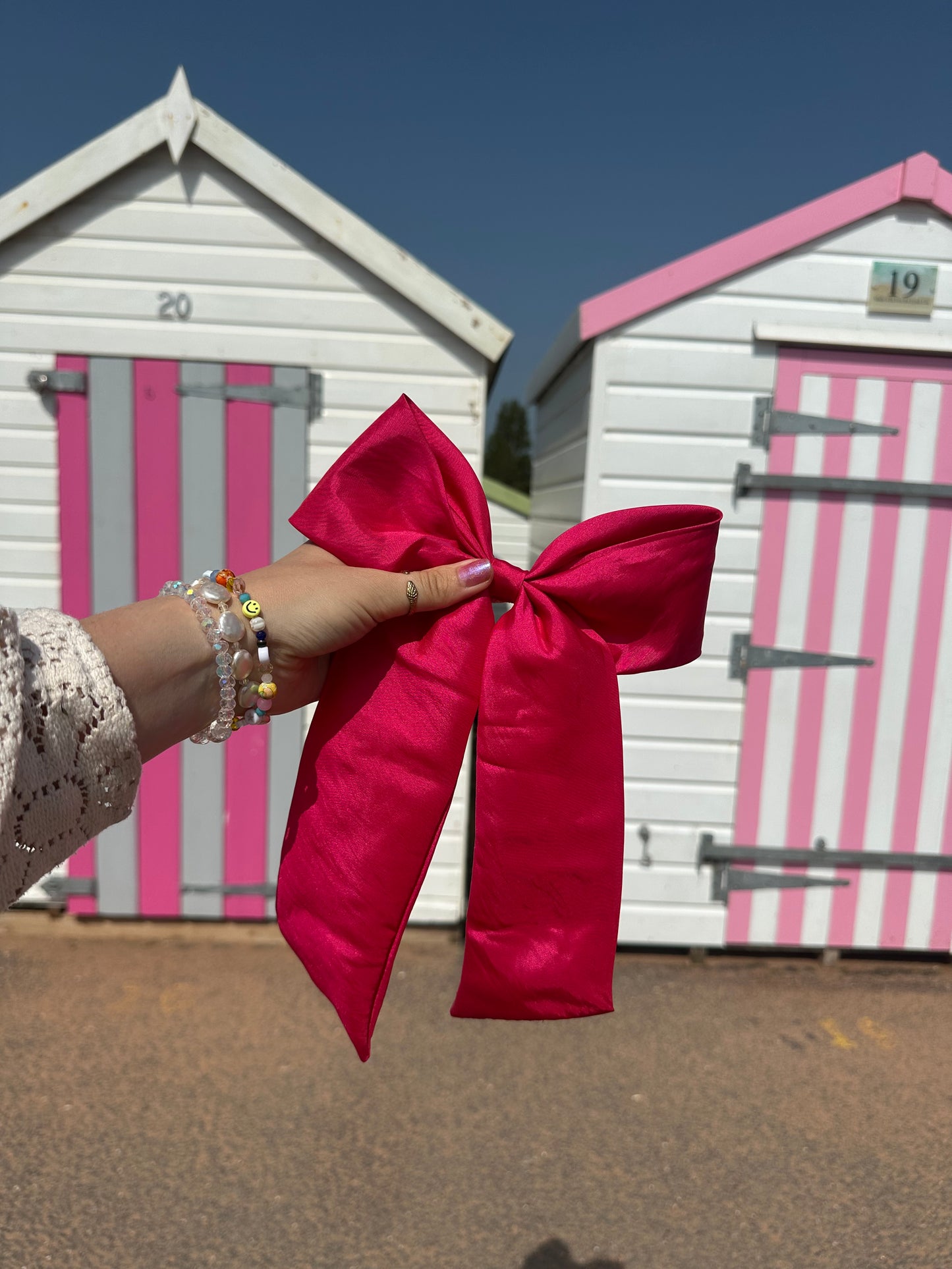 The Power Hair Bow in hot pink silk