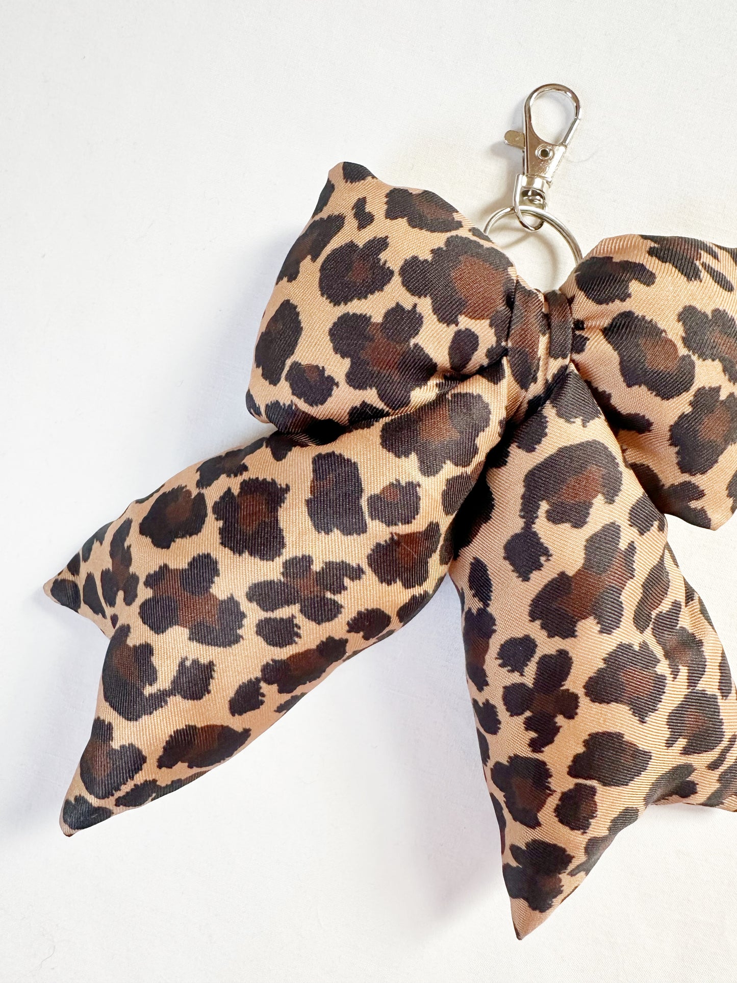 Puffy bow bag charm in leopard print