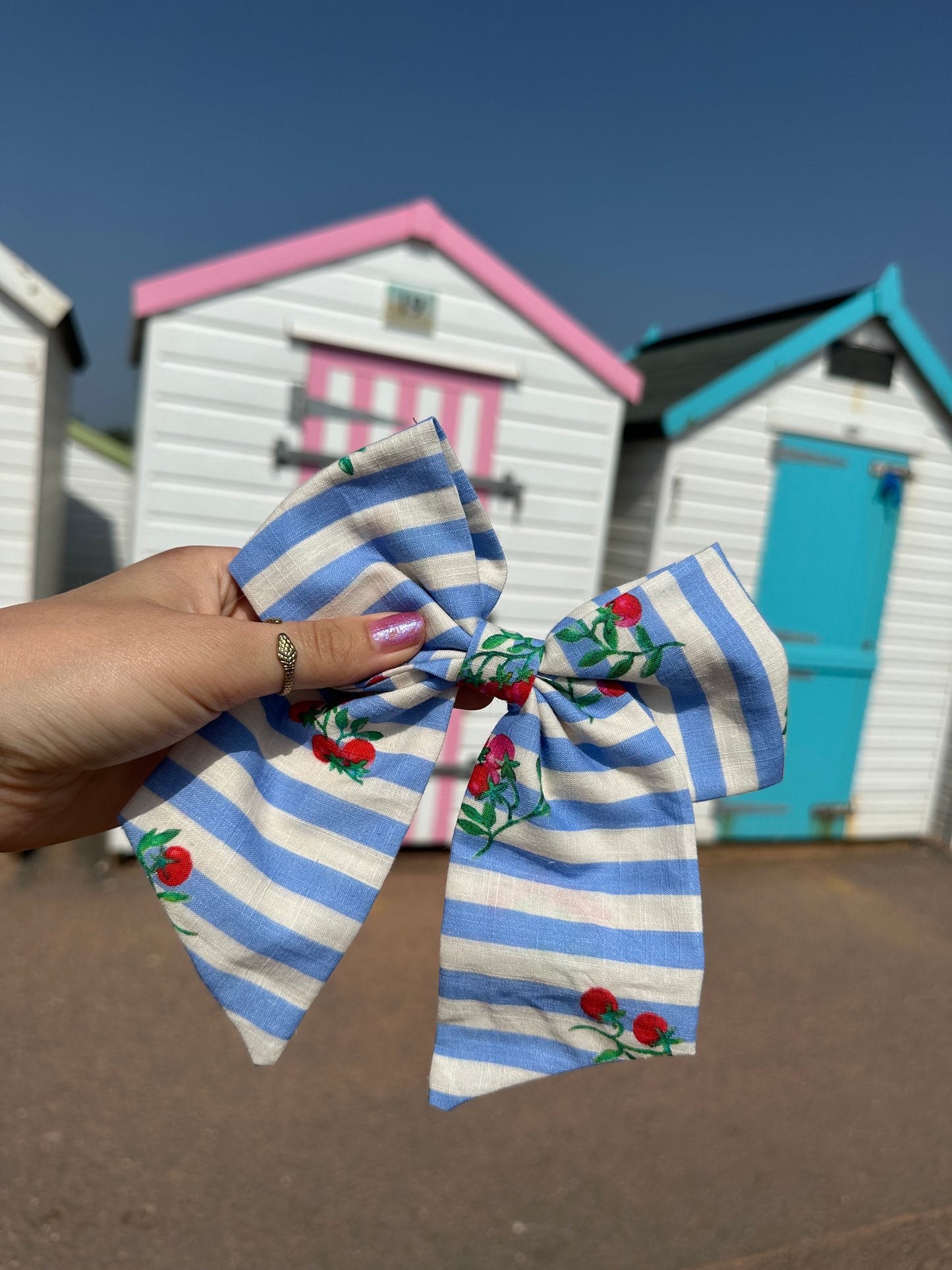 Beau hair bow in tomato & stripes