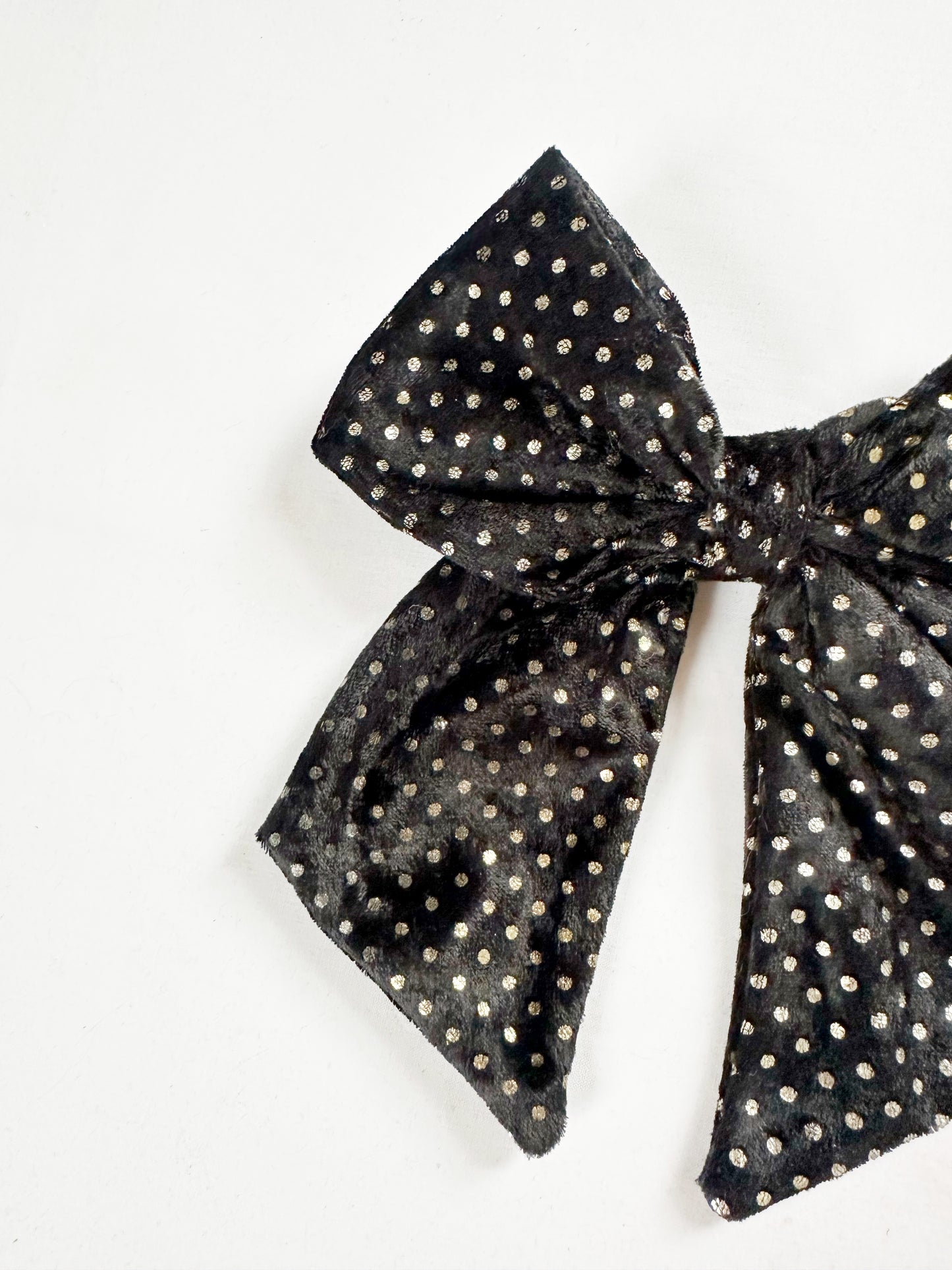 Beau hair bow in black and gold velvet