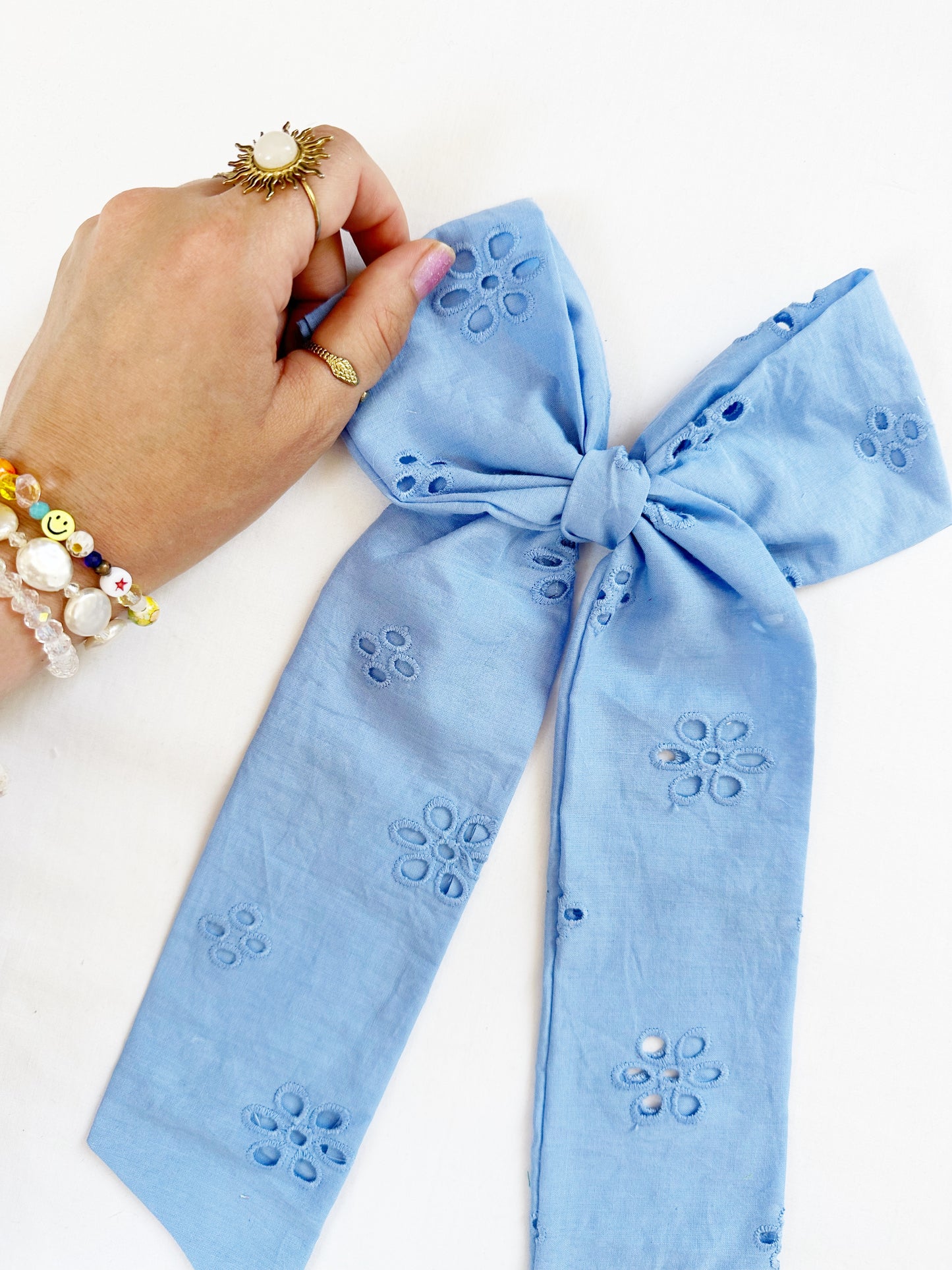 The Power Hair Bow in blue Broderie
