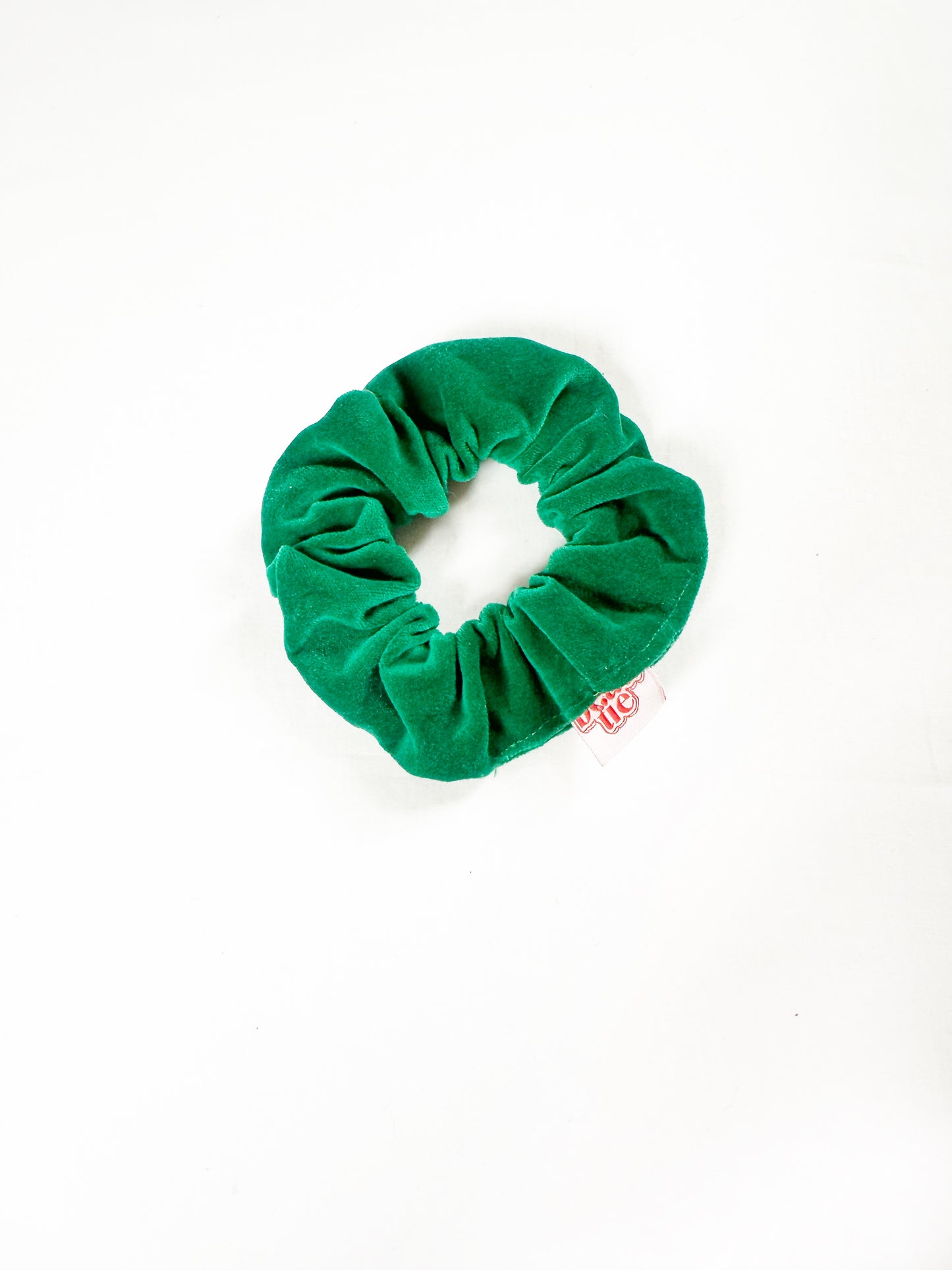 Mini scrunchie in emerald green velvet