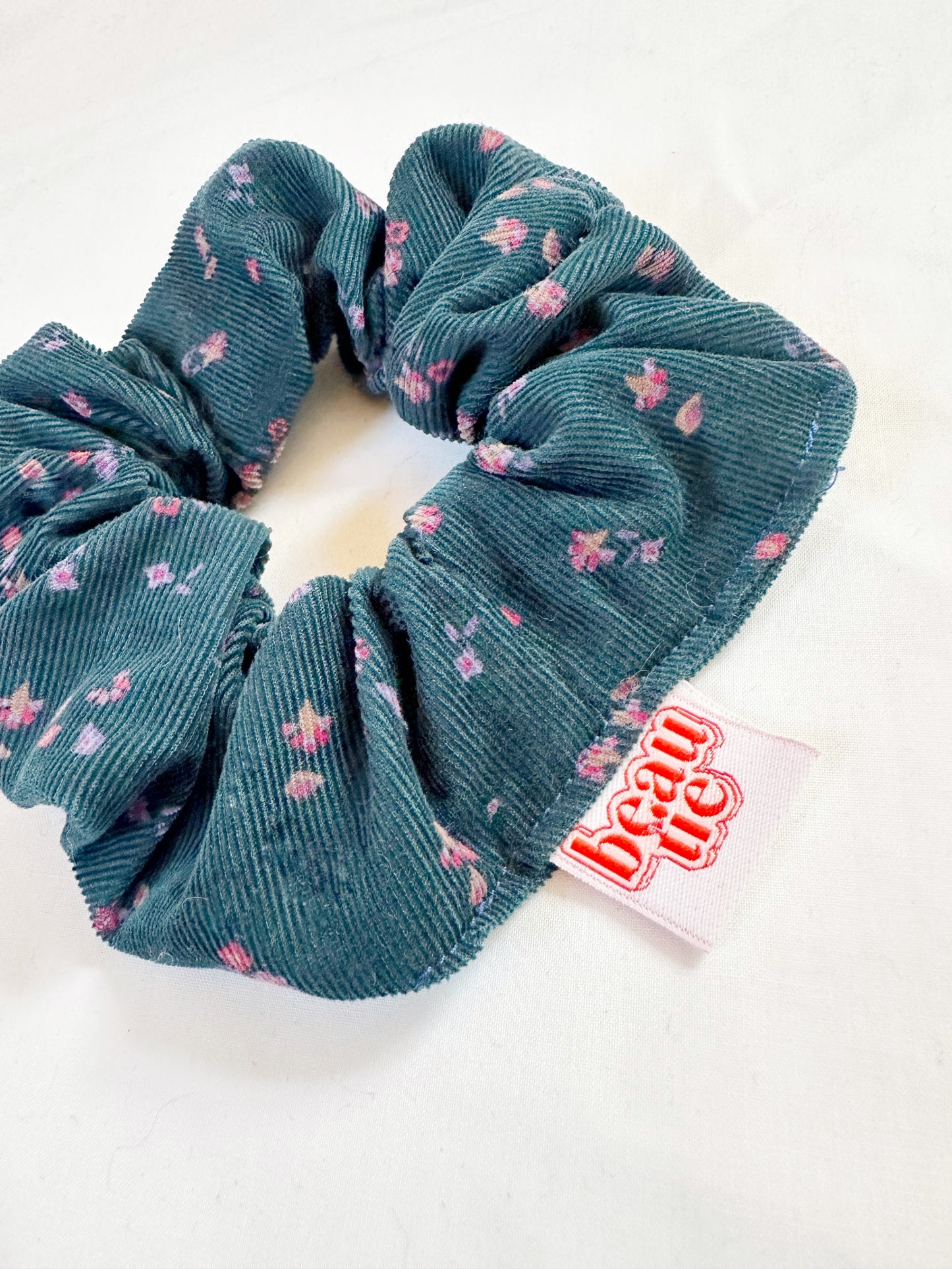 OG scrunchie in teal cord and pink floral