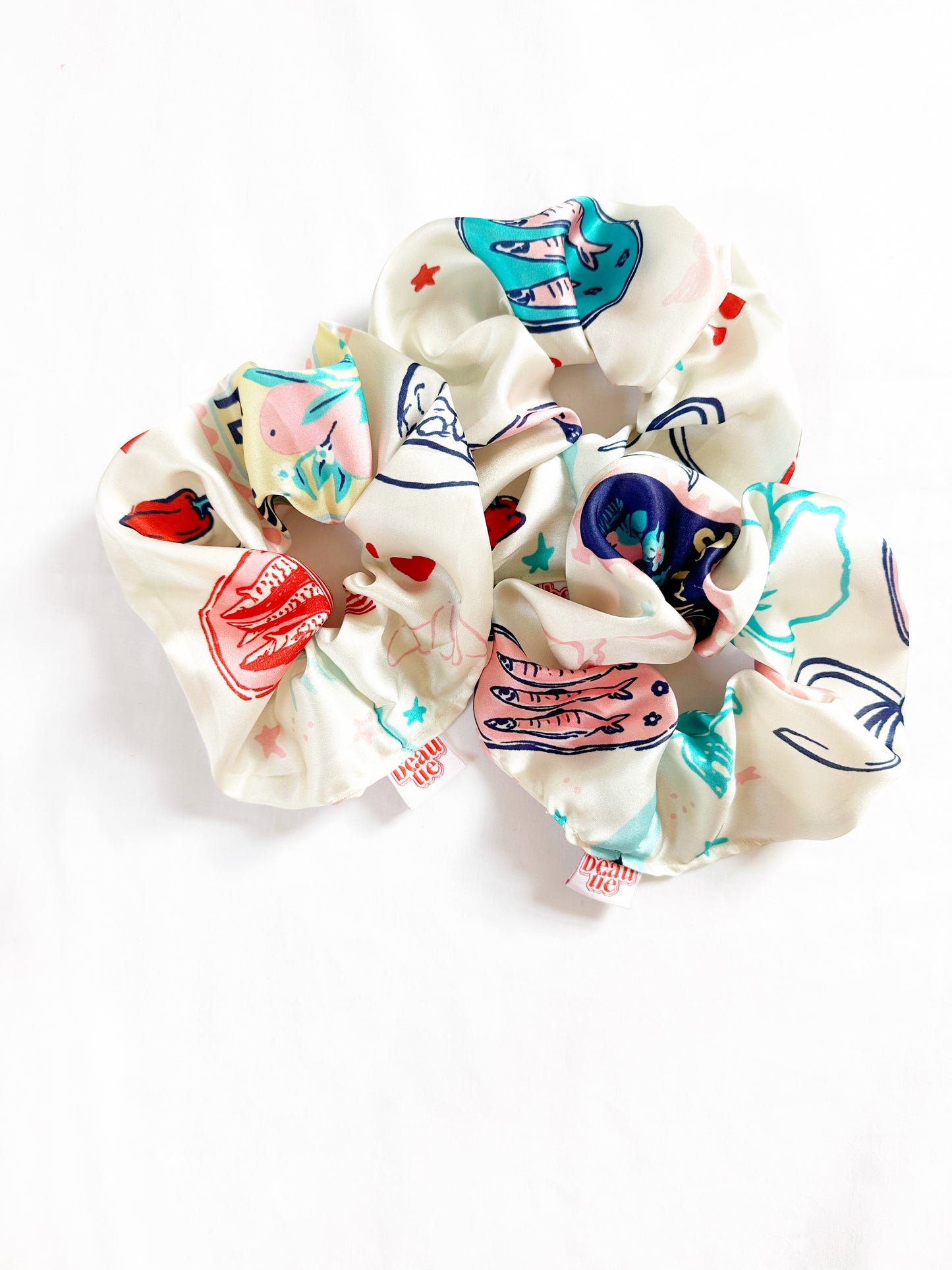 The OG scrunchie in silky sardine