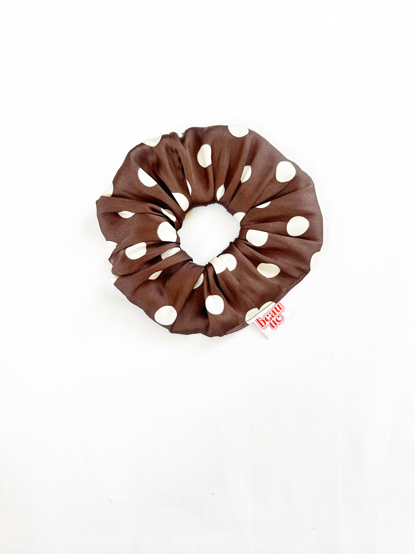 The OG scrunchie in brown polka dot