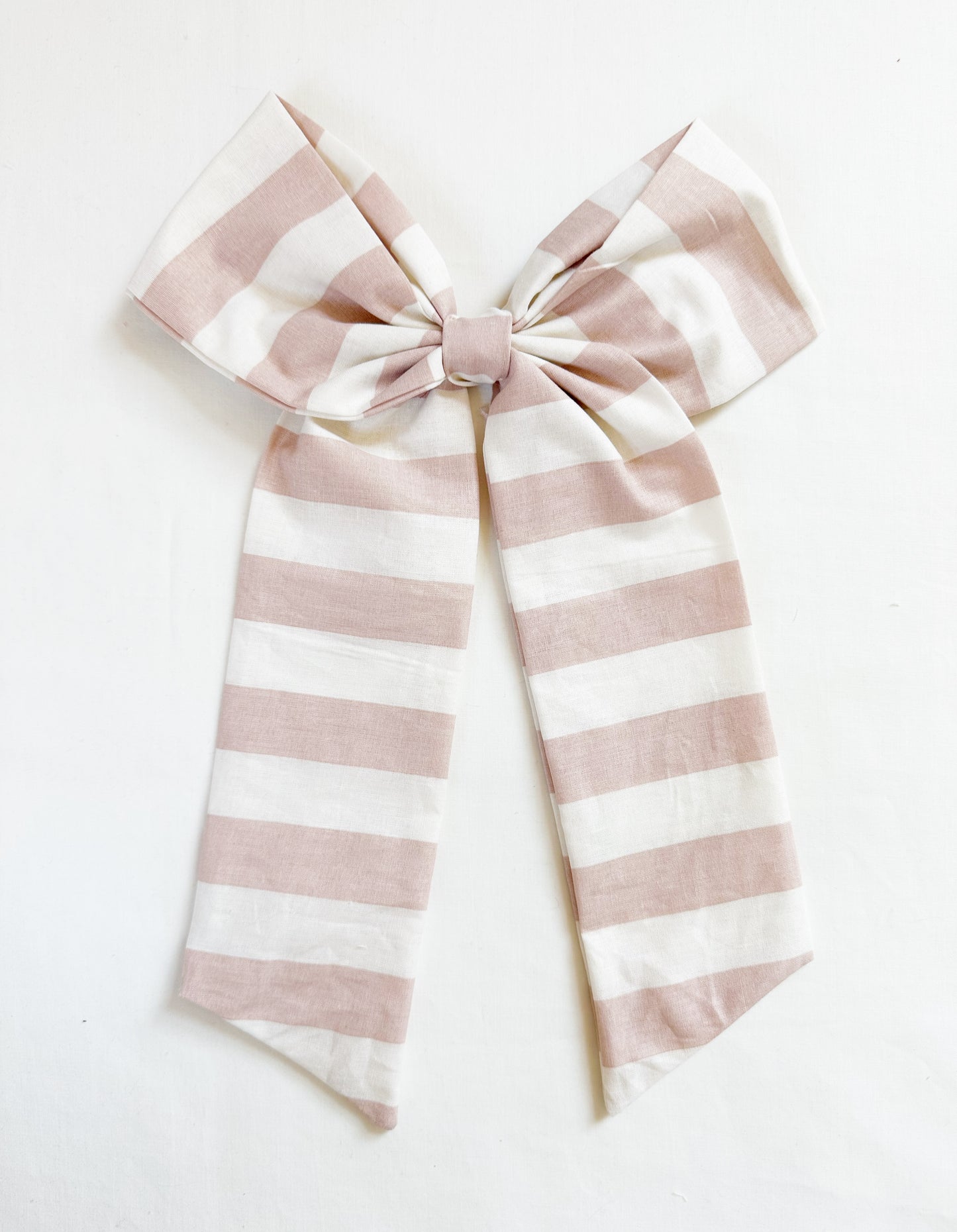 The Power Hair Bow in blush and white stripe