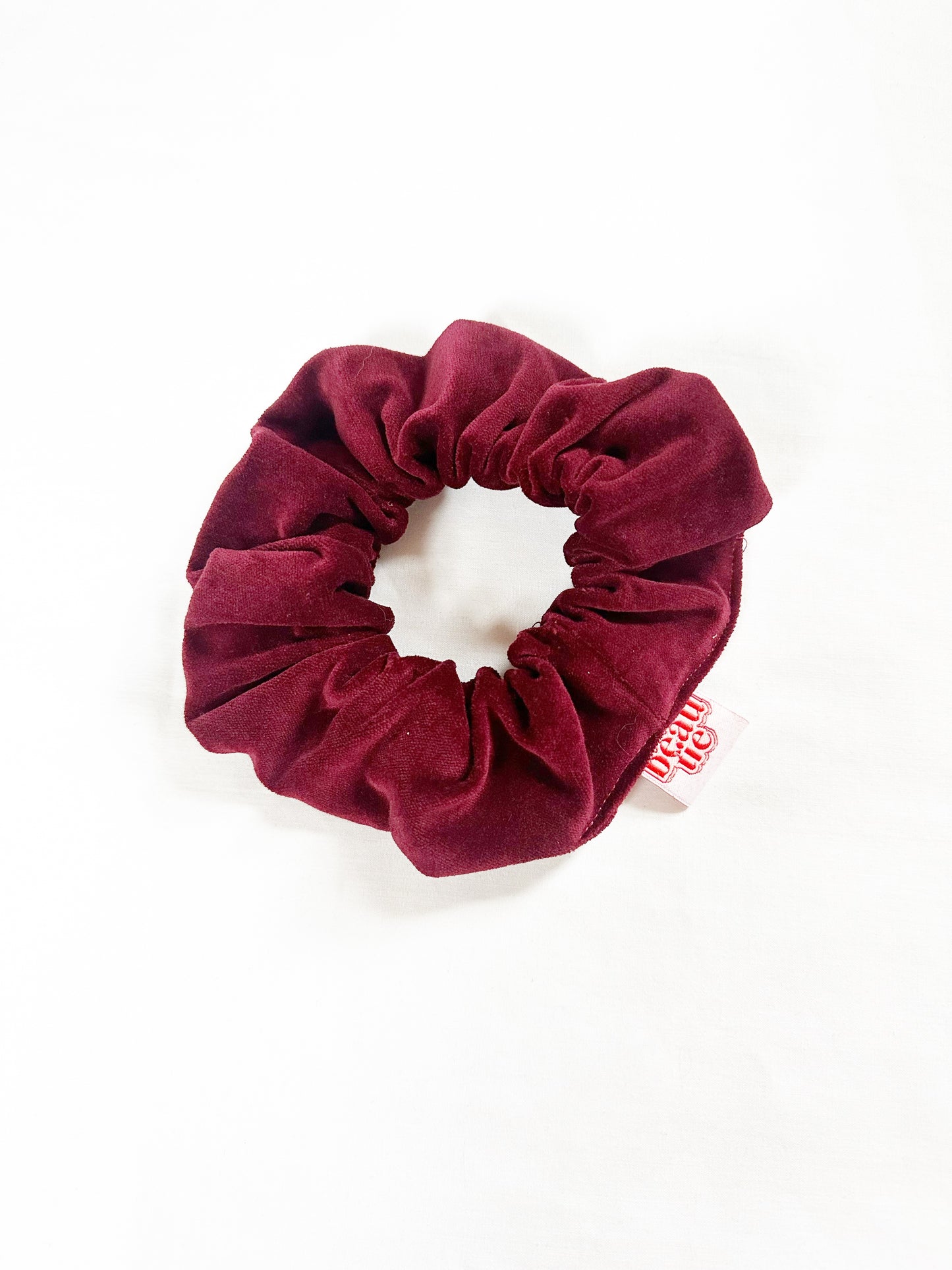 OG scrunchie in burgundy velvet