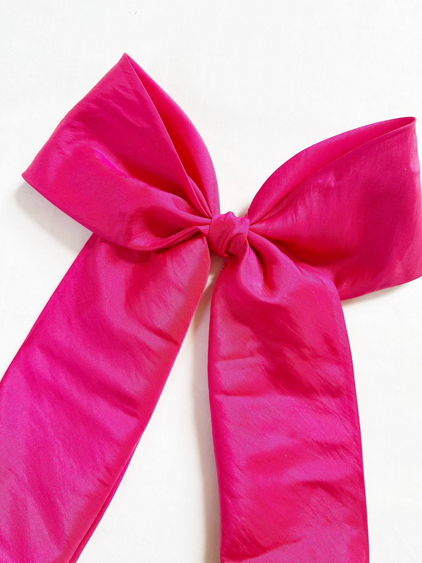 The Power Hair Bow in hot pink silk