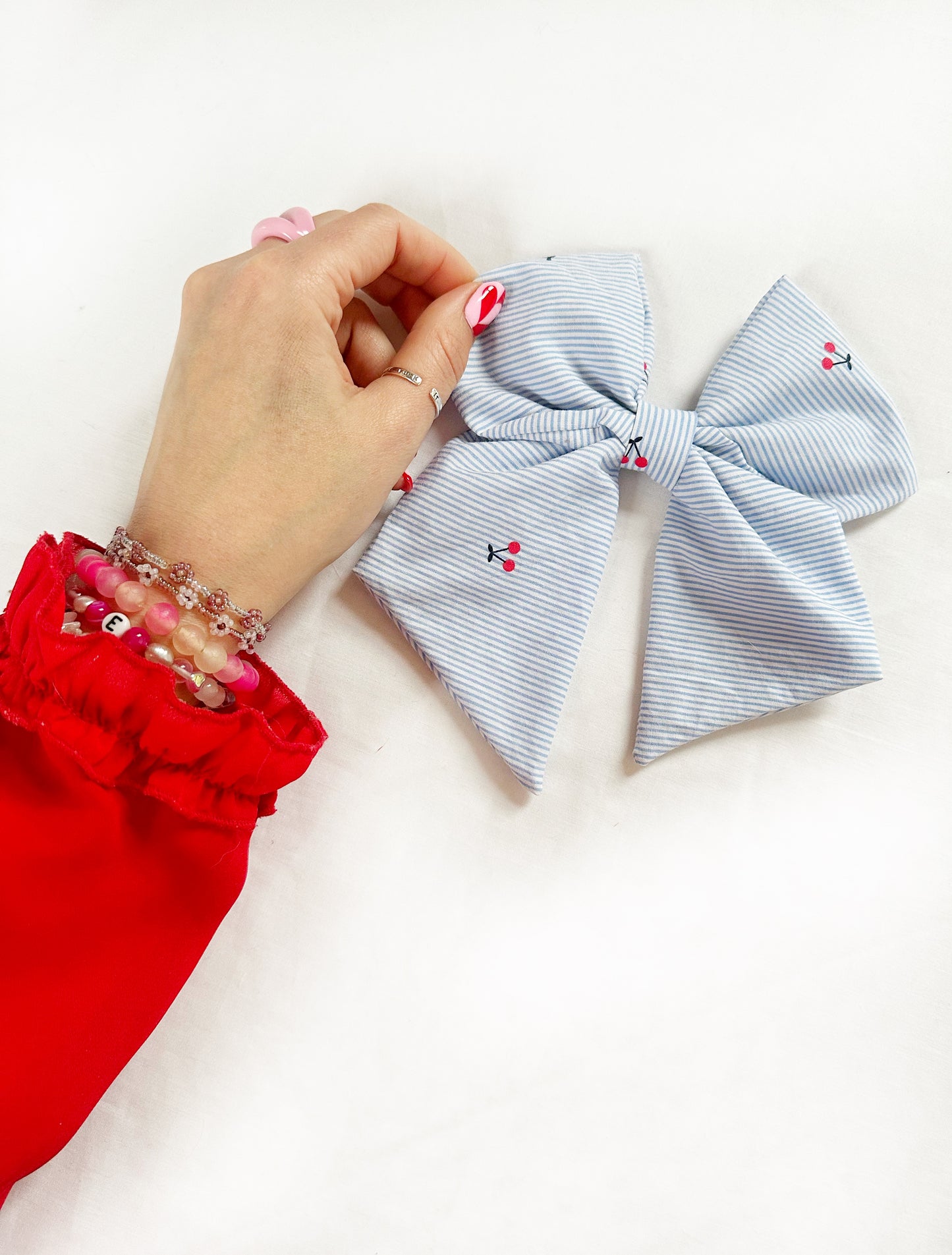 Beau hair bow in cherry print