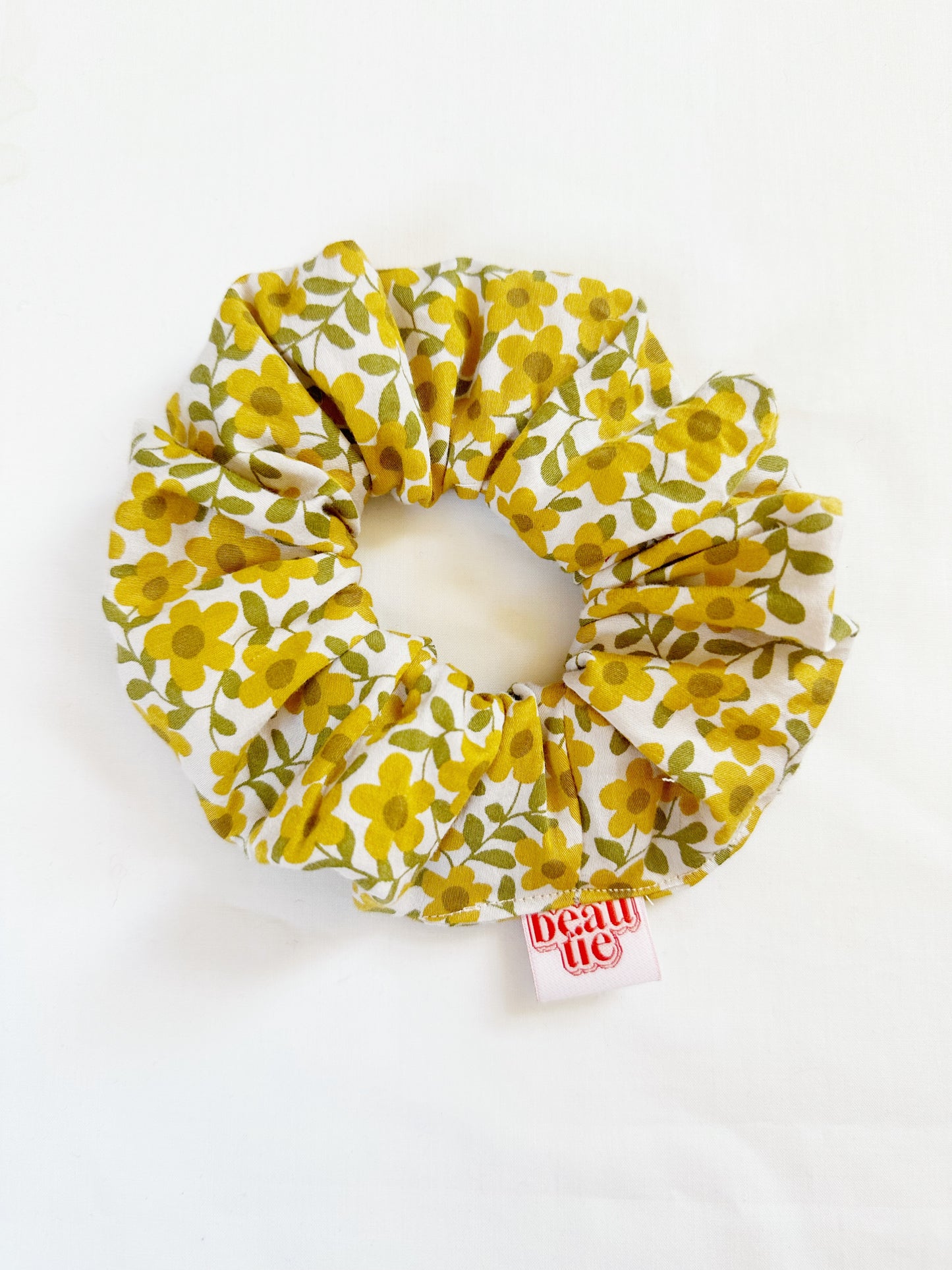 OG scrunchie in yellow floral