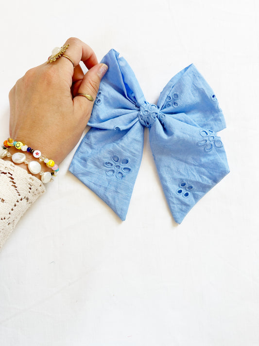 Beau hair bow in blue Broderie anglaise