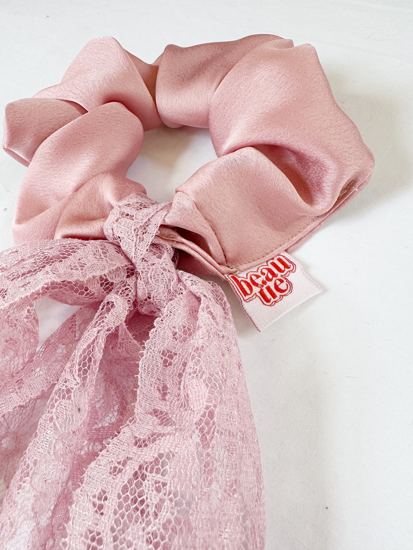 Lace bow scrunchie in silky ballet pink
