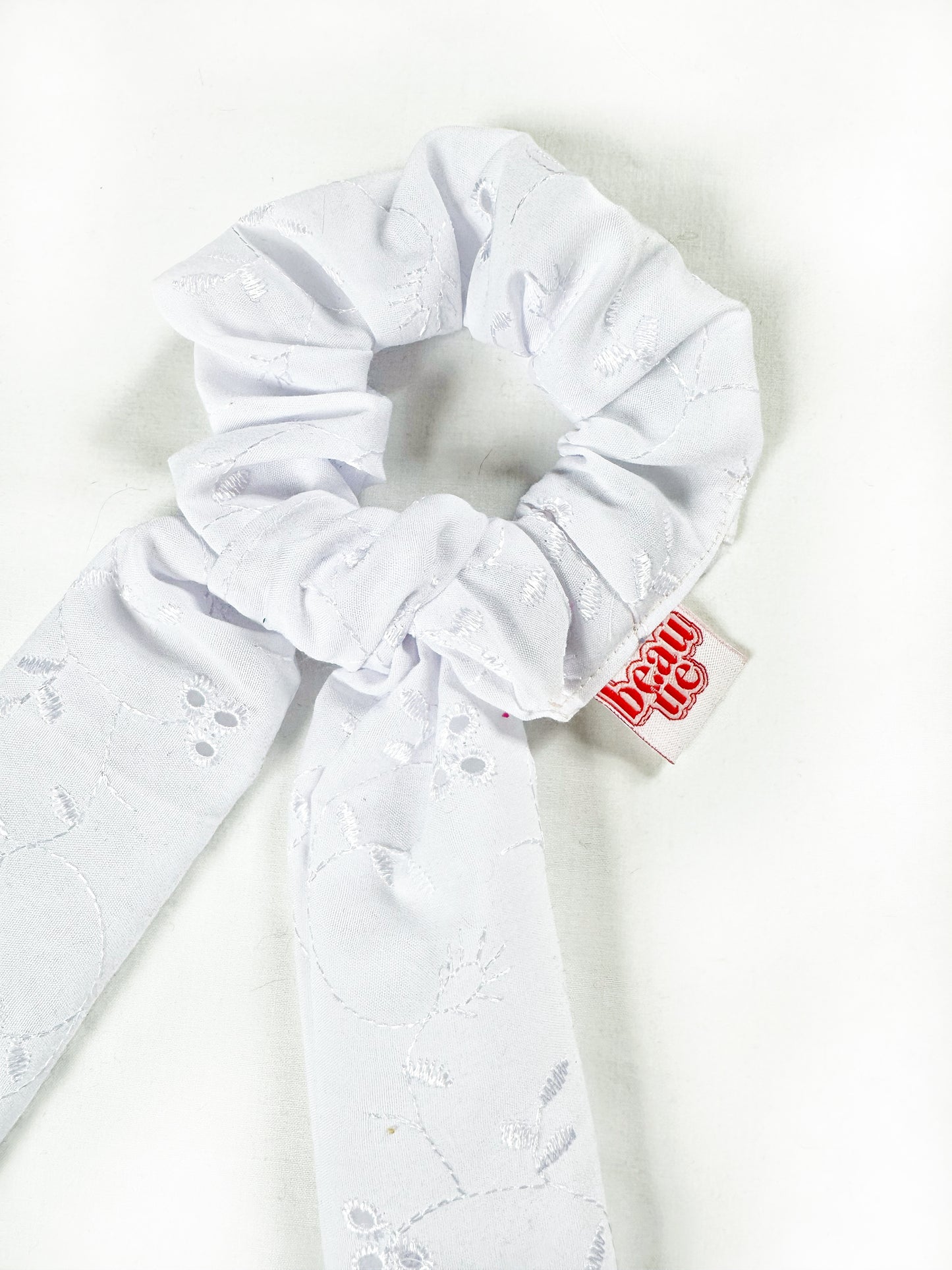 Dolly scarf scrunchie in white broderie, in mini or regular.