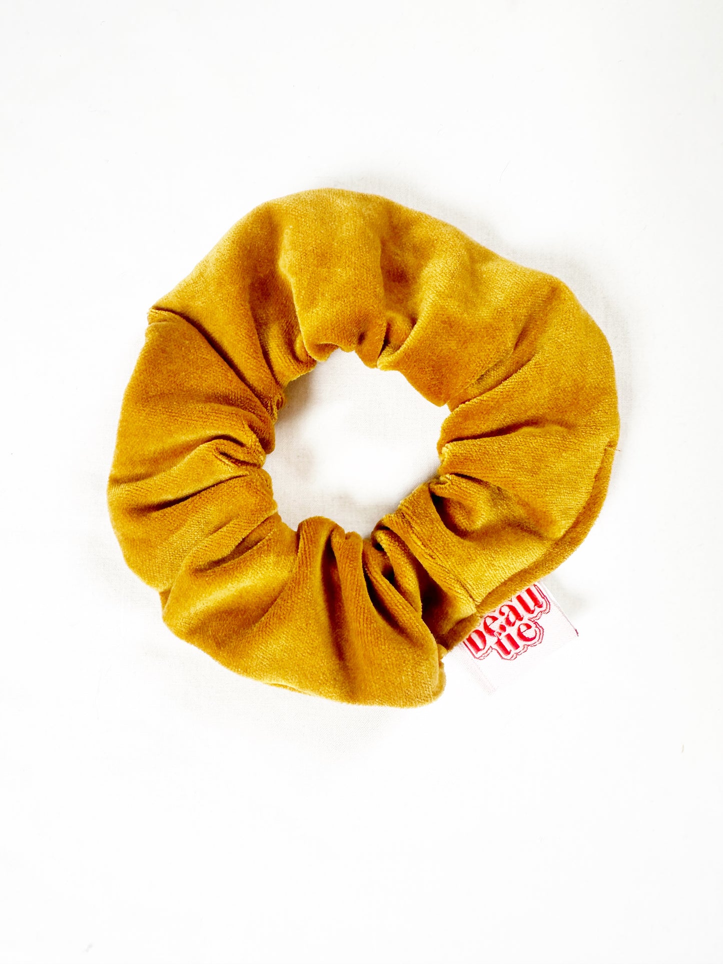 Mini scrunchie in mustard yellow velvet